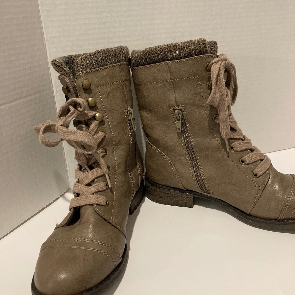 Woman’s part lace up on tan in color and no skid bottoms, good grip